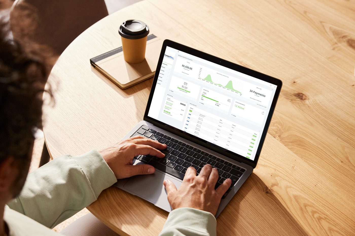 School administrator reviewing the CompuWerx TuitionPay dashboard on a laptop